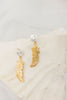 Aretes pluma y perla broquel