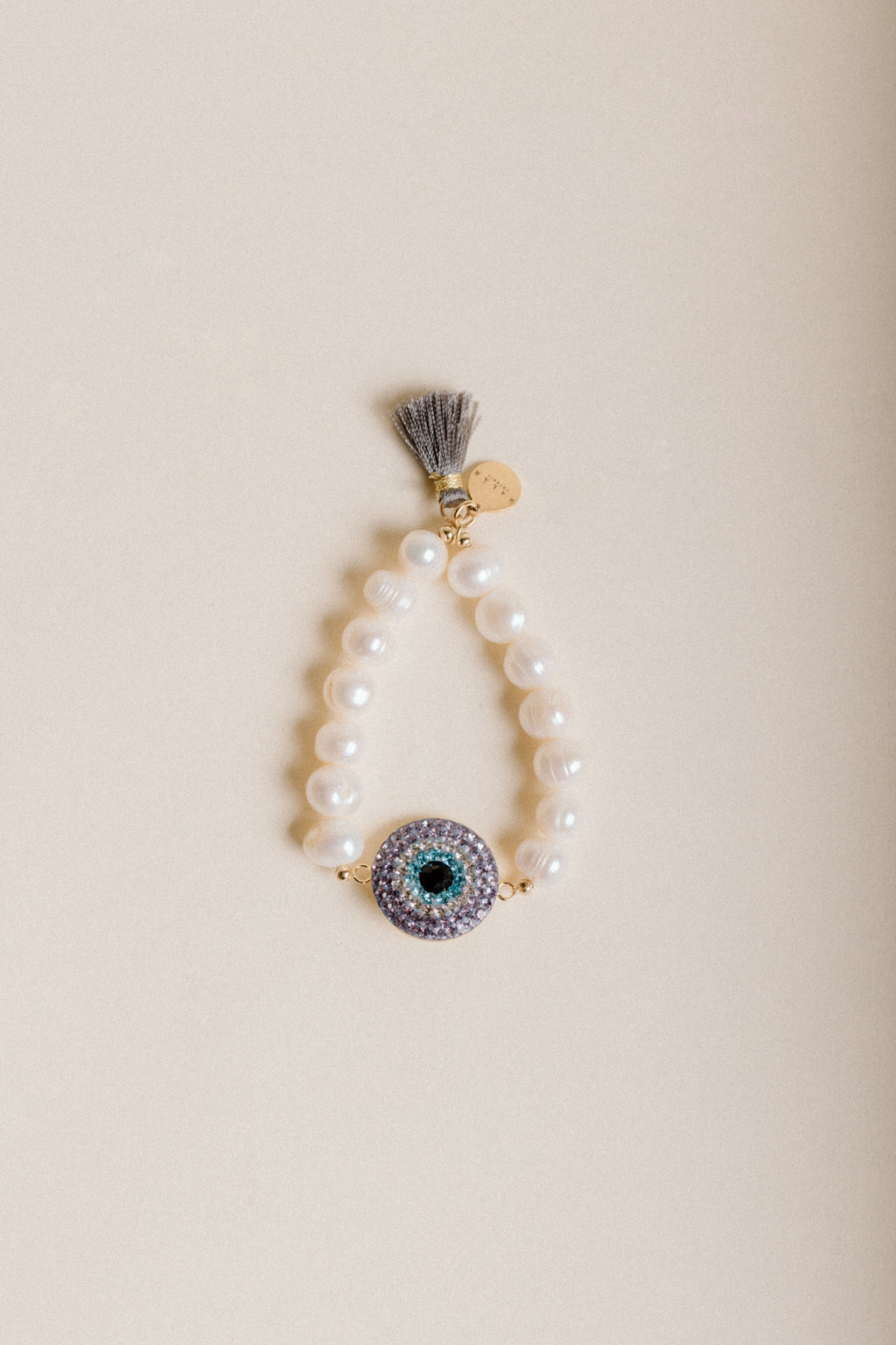 Pulsera de Ojo y Cristales Lila